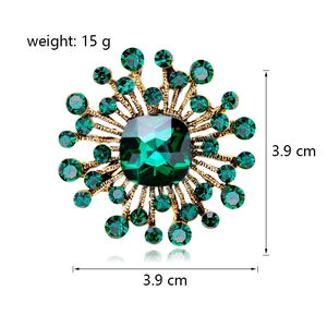 Macro detail of starburst crystal brooch with green center gemstone and dimensions