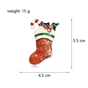 Detail view of Christmas stocking brooch with holly and candy cane, 5.5cm x 4.5cm size