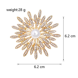 Detail showing golden sunflower brooch with crystals and pearl, 6.2cm size measurement