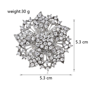 Detail view of flower brooch with crystals showing size 5.3cm and weight 30g