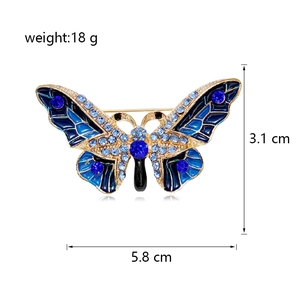 Vue détaillée de la broche papillon en émail bleu avec dimensions et cristaux brillants