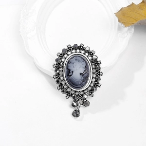 Vintage cameo brooch with female portrait profile and elegant crystal fringe design