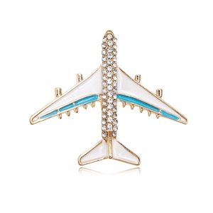 Elegant airplane brooch with white enamel wings and sparkling rhinestones on gold alloy