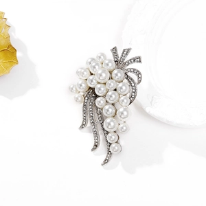 Close-up of silver grape brooch with white faux pearls and sparkling crystal accents