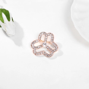Elegant rose gold flower brooch with sparkling white rhinestones and a central crystal
