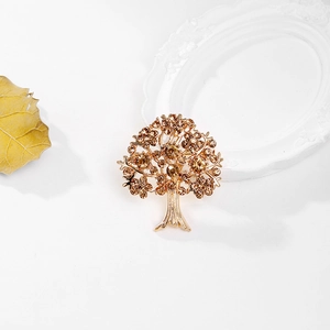 Broche Arbre de Vie dorée ornée de cristaux champagne et détails texturés