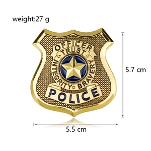 Detailed view of shield-shaped golden police badge with dimensions 5.7cm by 5.5cm
