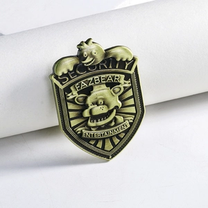 Bronze security shield badge with Freddy Fazbear relief and entertainment engraving