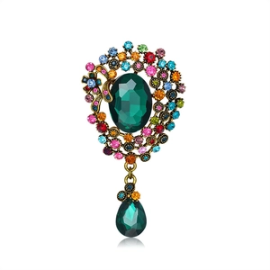 Vintage gold brooch with emerald green teardrop crystal and colorful rhinestones
