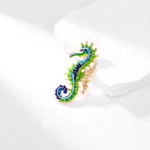 Elegant enamel seahorse brooch featuring blue-green gradient drip oil and sparkling rhinestones