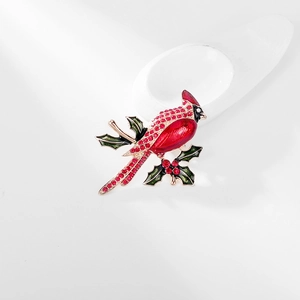 Elegant cardinal bird on holly branch brooch with red crystals and green enamel