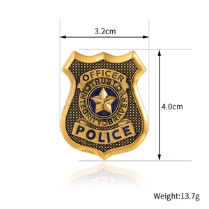 Golden police shield badge pin with officer trust integrity bravery and star emblem