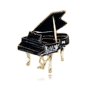 Elegant black enamel grand piano brooch with gold trim and musical instrument design