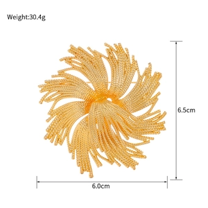 Vintage gold fireworks brooch with spiral metal texture, 6.5cm diameter, elegant jewelry