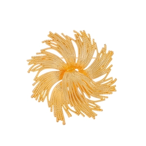 Vintage golden fireworks brooch with intricate woven texture and sunburst floral design