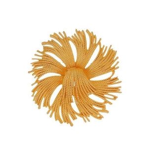 Macro detail of vintage gold fireworks brooch featuring intricate twisted wire petals