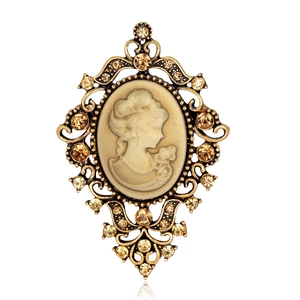Vintage Victorian cameo brooch with sparkling rhinestones and gold openwork border