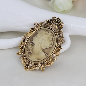 Vintage Victorian cameo brooch with elegant female profile and floral crystal border