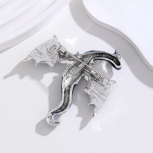 Vintage silver dragon brooch with blue enamel wings and sturdy back pin fastening