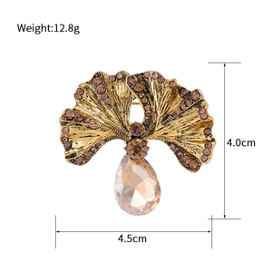 Vintage gold ginkgo leaf brooch with amber crystals and teardrop gemstone pendant