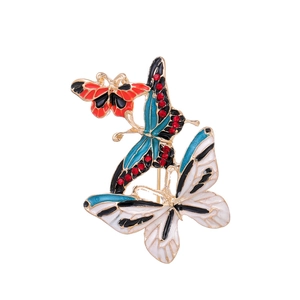 Three-layer butterfly brooch in red blue and white enamel with gold metal finish