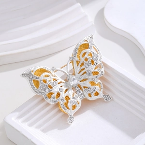 Vintage double-layered butterfly brooch with white crystals and silver plating