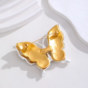 Vintage style double-layered butterfly brooch with gold and silver dual-tone finish
