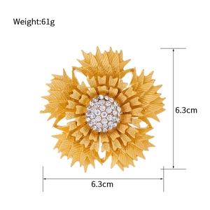 Vintage multi-layer gold flower brooch with sparkling rhinestones and brushed metal finish
