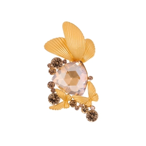 Elegant gold butterfly brooch with large champagne triangle gemstone and crystal accents