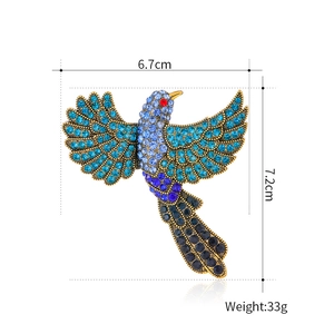 Broche colibri vintage avec cristaux bleus et base en alliage doré pour femmes