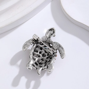Vintage silver turtle brooch with hollow design and secure pin closure back view