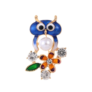Fashion owl brooch with blue enamel, white pearl, and colorful floral accents on gold base