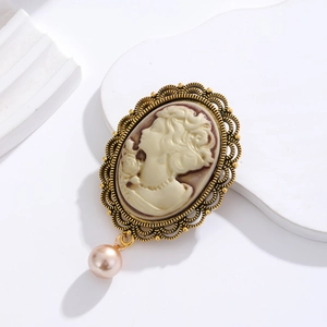 Vintage Victorian cameo brooch with gold openwork frame and pink faux pearl drop charm