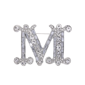 Elegant silver M-letter brooch with shimmering rhinestones for coats and sweaters