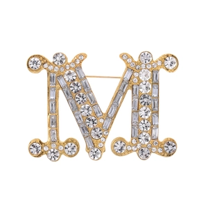 Elegant gold M letter brooch with sparkling pavé crystals and vertical pin back