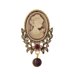 Vintage cameo brooch with female portrait and red crystal pendant on bronze frame