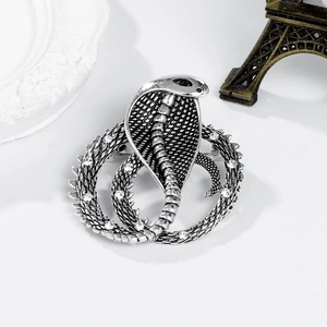 Vintage silver cobra brooch for suits featuring realistic snake scales and white rhinestones