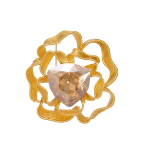 Vintage floral brooch with gold petals and champagne crystal for elegant suits