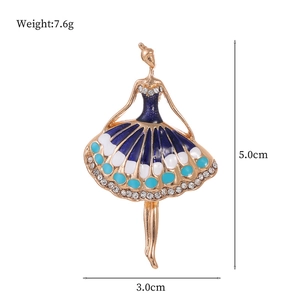 Elegant ballerina brooch with blue enamel dress and rhinestones on a white background