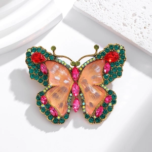 Vintage gold butterfly brooch with green rhinestones and colorful gemstones