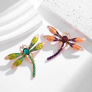 Elegant enamel dragonfly brooches with vibrant emerald and ruby colored gemstones