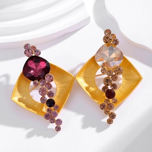 Elegant geometric square brooch with crystals and zircons on a gold metal base