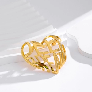 Elegant gold-tone hollow heart brooch featuring OFF DREAM cutout letters in a polished finish