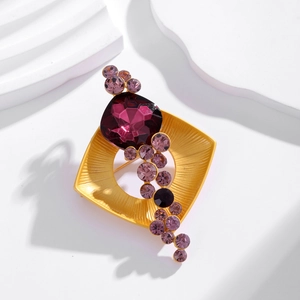Vintage gold square brooch with purple crystals and zircons on white wave background