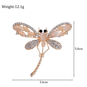 Sparkling dragonfly brooch with pink opal and crystals in gold finish, weight 12.1g