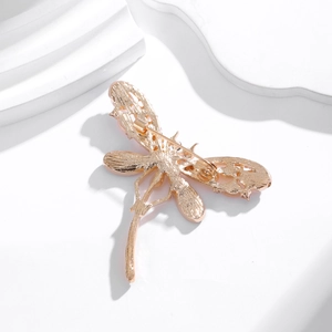 Exquisite hollowed dragonfly brooch with rose gold finish and secure pin closure