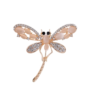 Elegant gold dragonfly brooch with champagne opal wings and sparkling white crystals