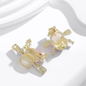 Back view of retro Chinese opera brooch set with gold plating and detailed openwork