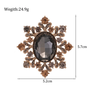Broche flocon de neige dorée vintage avec cristal gris et petits strass marron