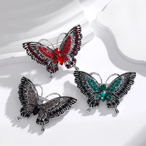 Vintage butterfly brooches with colorful rhinestones in red, green and black crystal tones